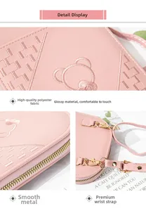 Detail of pink embroidered mobile pouch with smooth metal zipper and stylish wrist strap