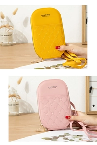 Detail view of the heart-quilted PU leather mobile phone crossbody bag in pink and yellow