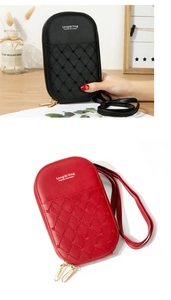 Detail of embroidered heart quilted crossbody bags with dual zippers in black and red