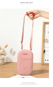 Pink PU leather crossbody phone bag featuring embossed bear and diamond quilted texture