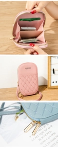 Detail of crossbody phone bag showing pink quilted heart texture and multi-card slots