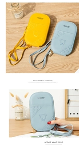 Detail of cute embroidered mini crossbody bag with bear pattern and zipper closure