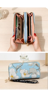 Detailed interior of double zipper blue floral wallet with multi-card slots and coin pocket