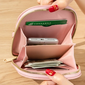 Pink faux leather crossbody phone bag with functional card slots and zipper compartment