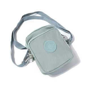 Waterproof mint green nylon crossbody bag with adjustable strap and double zipper pockets
