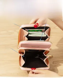 Internal view of pink stone pattern crossbody bag with multiple card slots and zip pocket