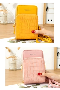 Detail of stone textured crossbody phone bags in yellow and pink with metal zippers