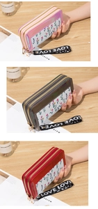 Close-up of double zipper long wallets with floral patterns and LOVE wrist straps
