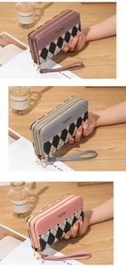 Detailed view of long double-zipper wallets in argyle pattern with wrist straps
