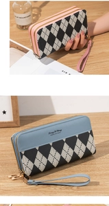 Detailed view of dual-zipper wallets in pink and blue featuring checkered canvas patterns