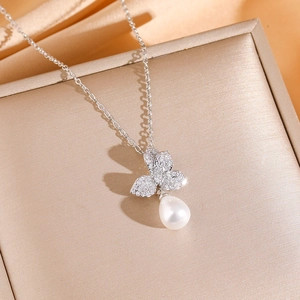 Elegant butterfly pendant necklace with zircon paving and a white teardrop pearl drop