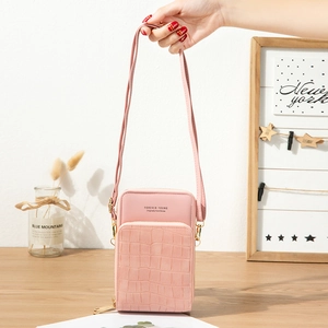 Pink stone pattern phone crossbody bag with Forever Young logo and golden zippers
