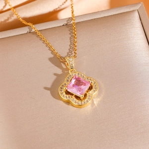 Elegant gold four-leaf clover necklace set with pink square zircon and crystal accents
