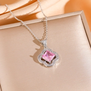 Silver four-leaf clover necklace with pink square gemstone and sparkling zirconia