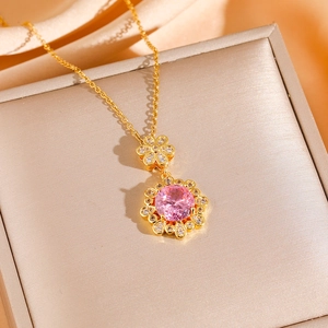 Pink zircon flower necklace in gold finish with sparkling crystals on satin background