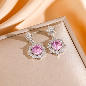 Pink zircon flower dangle earrings in silver finish with sparkling diamond accents