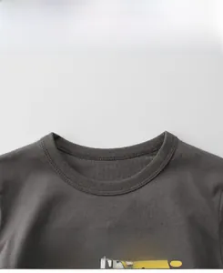Close-up of dark grey cotton t-shirt neckline and 'Love Life' printed graphic