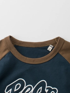 Raglan sleeve kids navy t-shirt with brown ribbed neckline and contrast letter graphic