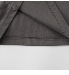 Detail of double-needle stitching and professional hem finish on kids gray cotton t-shirt