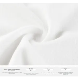 Detailed macro view of white cotton fabric texture and textile safety grade labels
