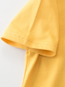 Yellow kids t-shirt detail showing durable double-stitched sleeve and premium cotton fabric