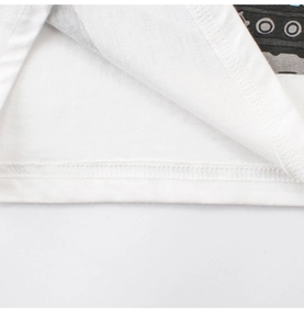 Close-up of double-needle hem stitching and cotton fabric texture on white t-shirt