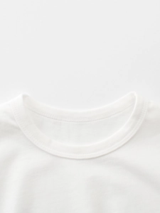 Close-up of boys white cotton T-shirt featuring a durable crew neck with double stitching