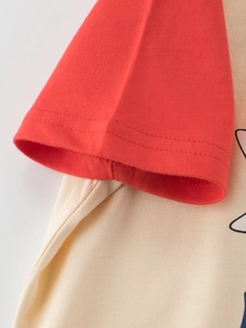 Kids short sleeve t-shirt with red raglan sleeves and cream cotton body detail