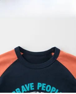Detail of crew neck ribbing and Brave People print on raglan sleeve kids t-shirt