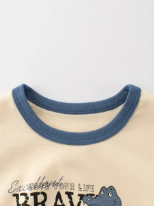 Short-sleeved kids T-shirt featuring a cartoon crocodile print and bicolor crew neck