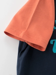 Kids orange and navy blue raglan sleeve cotton T-shirt with detail stitching and print
