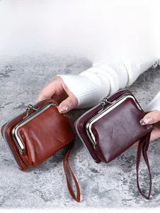 Dual-compartment vintage purses with kiss-lock and zipper in brown and burgundy finishes