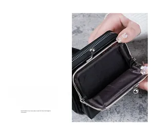 Detail of a black PU leather wallet featuring a vintage metal kiss-lock and spacious interior