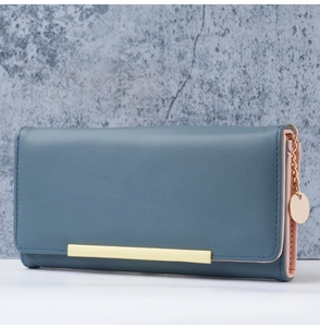 Gray-blue long wallet with gold bar decoration and contrasting pink interior lining