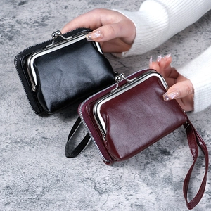 Fashionable women's PU leather wallet with wrist strap and kiss-lock closure in black and red