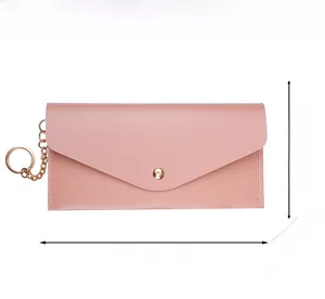 Pink faux leather clutch dimensions showing 18.7cm length with gold hardware details