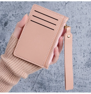 Pink lychee texture slim card wallet with wrist strap and gold zipper details