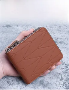 Brown leather men's wallet featuring elegant V-shaped quilting and a metal L-shaped zipper