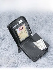 Detail view of the black pebbled leather wallet interior showing multiple card slots