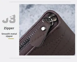 Detail of smooth metal zipper and brown lychee grain leather on men's short wallet