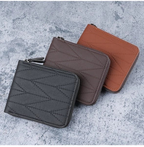 Close-up of men's short wallets in black and brown with cross-line stitching details