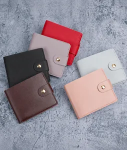 Multiple colorful minimalist wallets with lychee texture PU leather and gold snap closure