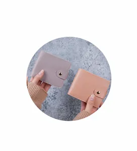 Mini minimalist leather wallets in light purple and nude pink with golden snap button