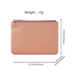 Mini peach pink leather coin purse with purple zipper and dimensions 12.2x8.9x1cm