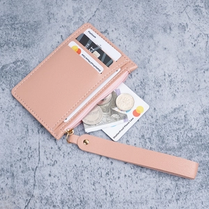 Slim pink PU leather card holder with wristlet strap and gold zipper pocket for women