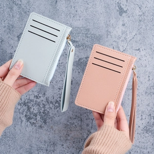 Slim PU leather card holder with zipper pocket and wrist strap in light blue and pink