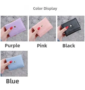 Detail of four colorful PU leather wallets featuring gold heart buckles and Sweet Dream text