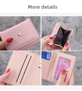 Close-up of pink PU leather wallet with gold heart charm and retro coin compartment
