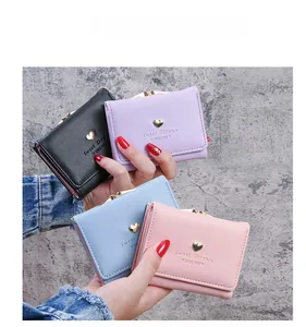 Short women's wallets in multiple colors with heart metal buckle and PU leather finish