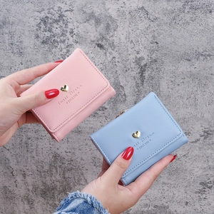 Short tri-fold women's faux leather wallet with heart ornament in pink and light blue